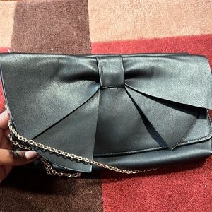 Bow clutch purse